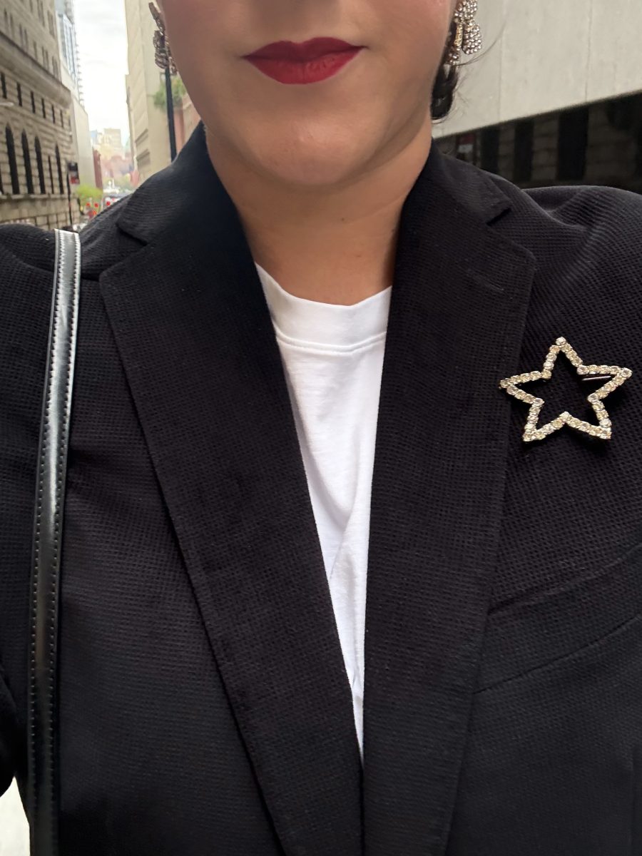 Star brooch with black blazer and white tee